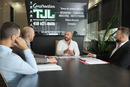 men from Construction TJL in team meeting 