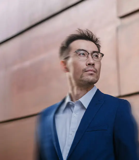 Man standing in front of a wall