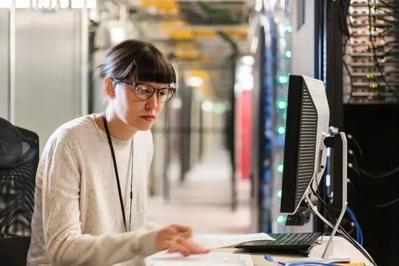 Server room technician wearing glasses